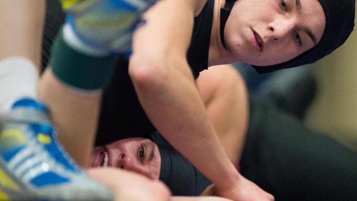 Mount Baker's Natalie Smith works toward pinning Burlington-Edison's Ashley Yates at the Northwest Conference Girls' Wrestling Tournament on Saturday, Jan. 9, at Nooksack Valley High School.