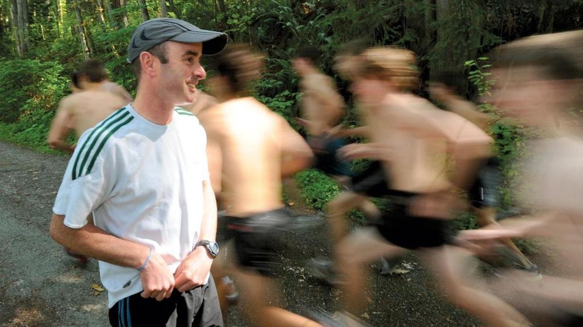 Sehome coach Kevin Ryan watches the 2009 Mariners cross country team practice in the Sehome Arboretum in Bellingham. Ryan has been selected the 2016-17 National Coach of the Year in girls track and field by the NFHS Coaches Association.