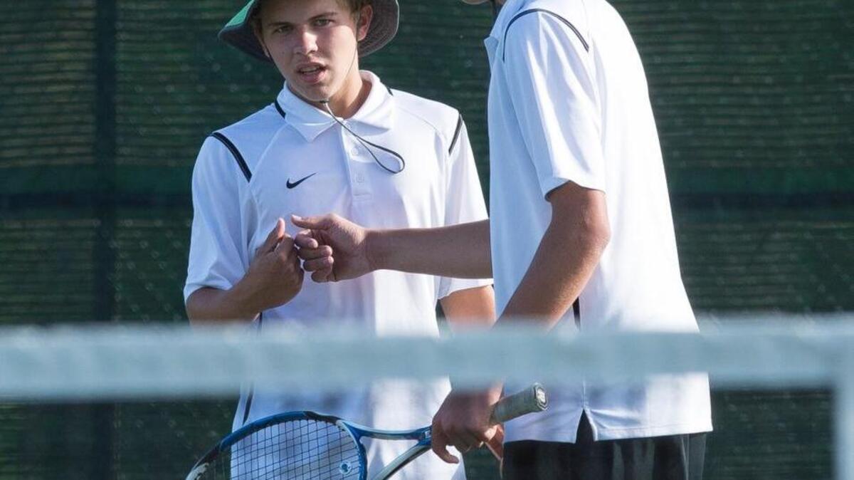 
Sehome doubles tennis team Sam McNamee and Wyatt Brugge bump fists after winning a point during a match against Anacortes on Wednesday, Sept. 23, at Sehome High School.
