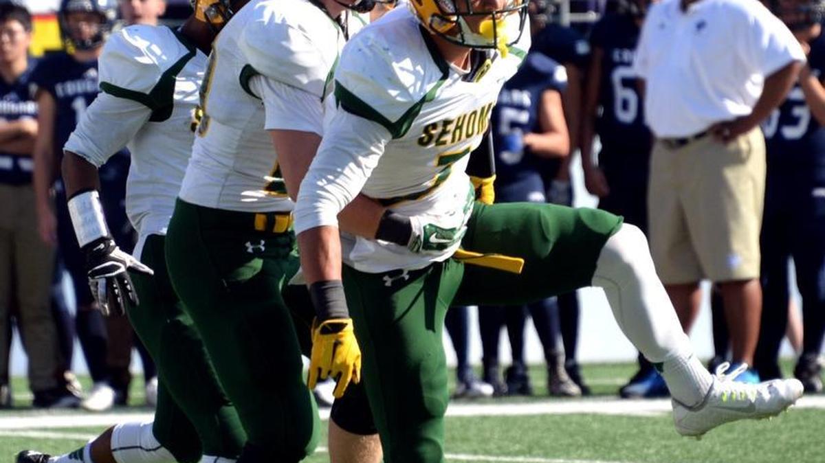 Sehome safety Taylor Rapp celebrates after scoring against Cascade Christian during a football game Saturday, Sept. 5, at Husky Stadium in Seattle.