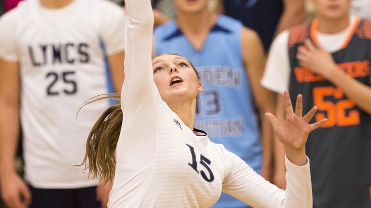 Lynden Christian’s Kara Bajema spikes the ball against King’s during the 1A Northwest District Volleyball Tournament at Lynden Christian High School on Wednesday in October 2014.