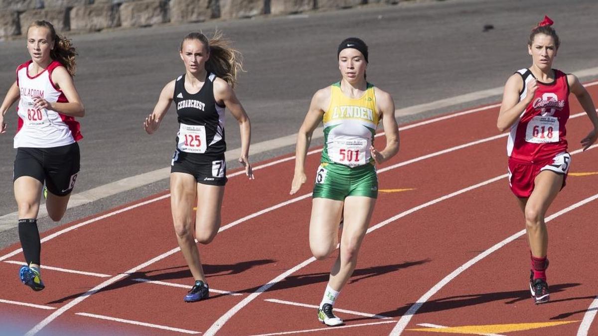 Lynden’s Jasmyne Neria, third, from left, rounds the courner at Mount Tahoma High School during the 2015 Class 2A State Track and Field Meet. Neria will run for Central Washington next year.