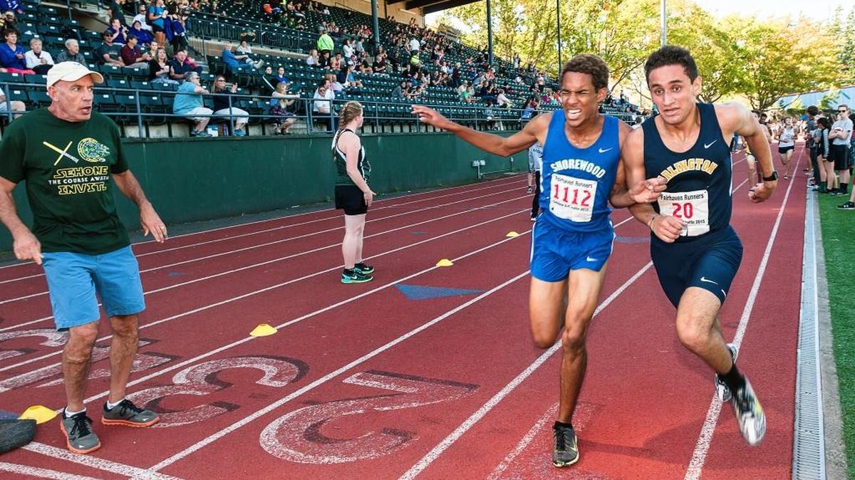 
Shorewood junior Devan Kirk (1112), left, and Arlington junior Eric Acero-Rosas (20) battle for 8th place during the Sehome Invitational Cross Country meet at Civic Field in Bellingham, Wash., on Saturday Sept. 12, 2015. Kirk was awarded the postition.
