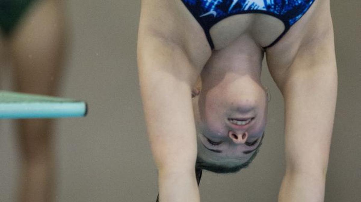
Squalicum's Amber Caron dives to finish first during a meet against Sehome at Arne Hanna Aquatic Center on Tuesday, Oct. 21, 2014, in Bellingham.
