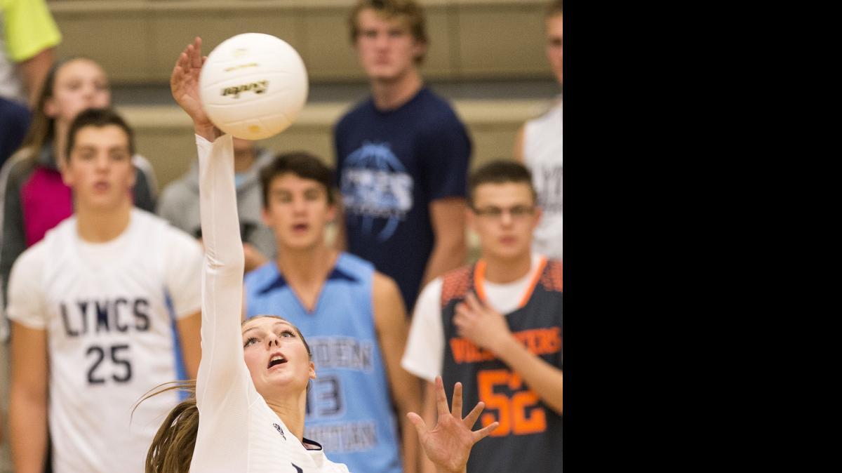 
Lynden Christian's Kara Bajema spikes the ball against King's during the 1A Northwest District Volleyball Tournament at Lynden Christian High School on Wednesday, Oct. 29, 2014 in Lynden, Wash. The Lyncs advanced to the championship round of the tournament with their victory. 
