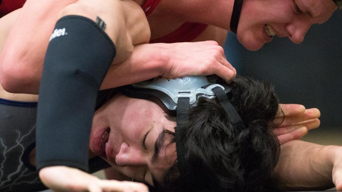 Squalicum's Michael Daniels fights to avoid being flipped to his back by Bellingham's Rory Stevenson at the Northwest Conference Wrestling Championships on Saturday, Jan. 16, at Meridian High School.