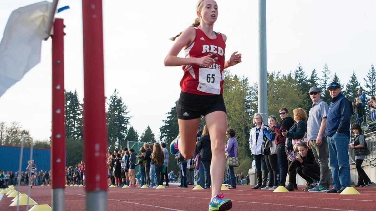 Bellingham's Annika Reiss cross the finish line first during the girls’ varsity race at the 2015 NWC Cross Country Championships on Thursday, Oct. 22, at Civic Stadium in Bellingham.