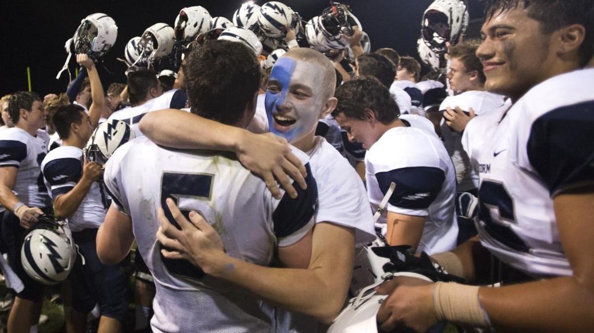 Squalicum fans and players celebrate a 27-0 victory over Lynden on on Sept. 18. The Storm are expected to move up to the Class 3A ranks for the next three years.