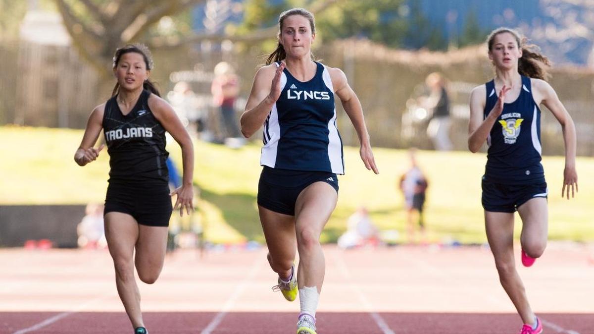 Lynden Christian’s Hannah Rusnak, center, Meridian’s Mali Mack, left, and Squalicum’s Audra Johnson compete in the girls’ 100 meter dash.