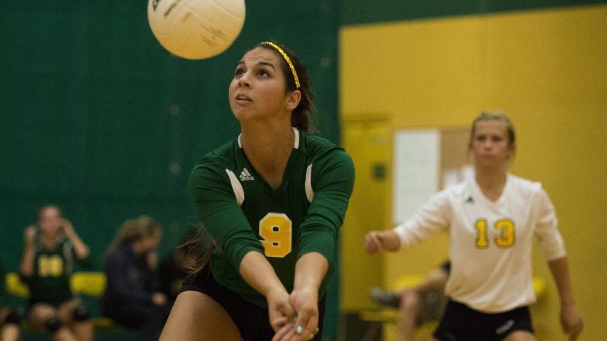 
Lynden's Ally Dahm lunges to bump the ball in the championship game against Stanwood in the Lynden Volleyball Tournament on Saturday, Sept. 13, 2014, in Lynden.
