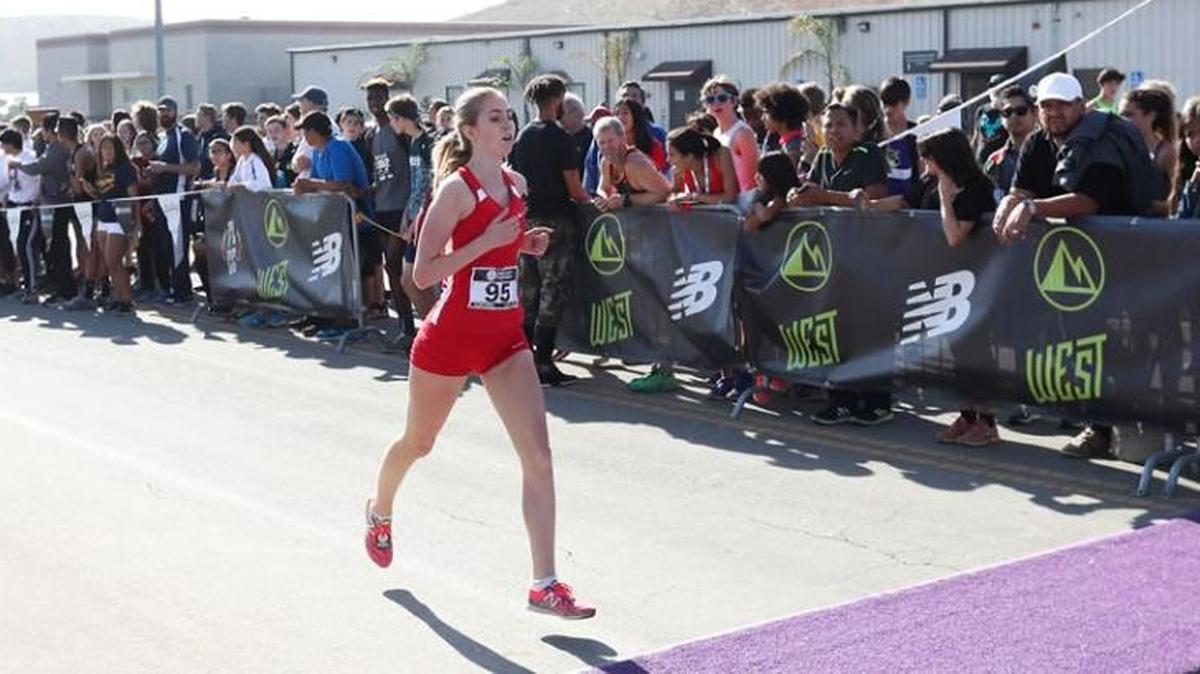 Bellingham High junior Annika Reiss crosses the finish line eighth in the Foot Locker Cross Country Championships West Regional Saturday at Walnut Creek, California, qualifying her for this weekend’s national championships in San Diego.
