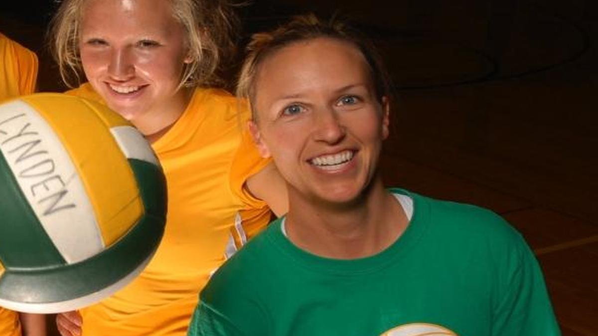 Former Lynden volleyball players Brandi Benner, left, Jessi Roberts, and Hannah Swanson and coach Chris Elsner helped the Lions to a third-place finish at state in 2008. After eight years off, Elsner returns to coach the program this fall.
