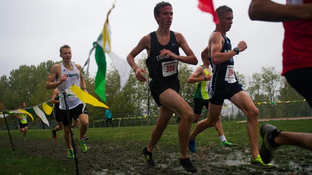 Meridian’s Kenny Barnes (300) battles for position during the Northwest Conference Cross Country Championships Oct. 19 in Bellingham.