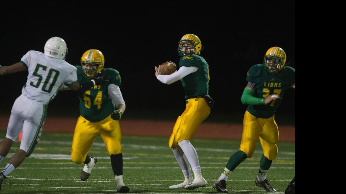 Lynden High quarterback Sterling Somers looks downfield against Shorecrest in the Class 2A NW district playoffs on Nov. 7, 2014 at Civic Stadium in Bellingham, Wash. 
