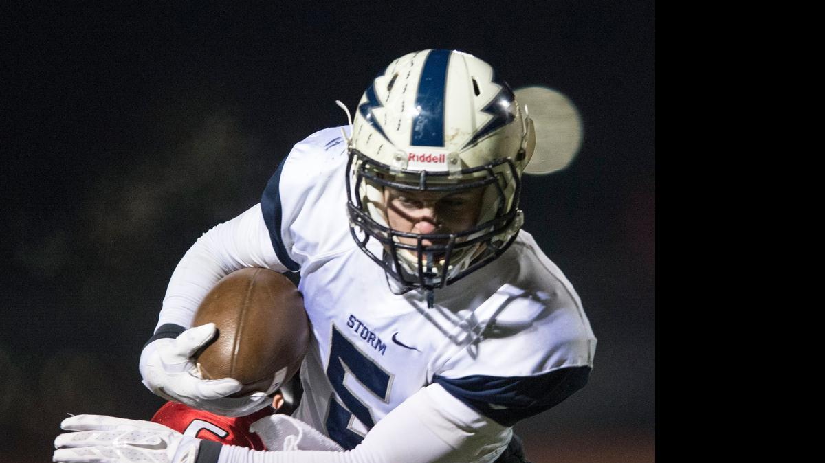 
Squalicum's Ben Peterson breaks an attempted tackle by Orting's Griffin Rose in the first round of Class 2A state playoffs on Friday, Nov. 14, at Orting High School in Orting, Wash. 
