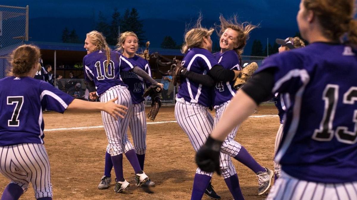 Nooksack Valley players celebrate defeating Lynden Christian in extra innings to secure a spot in state playoffs on day one of the Class 1A Bi-District Tournament on Thursday, May 19, at Janicki Fields in Sedro-Woolley.