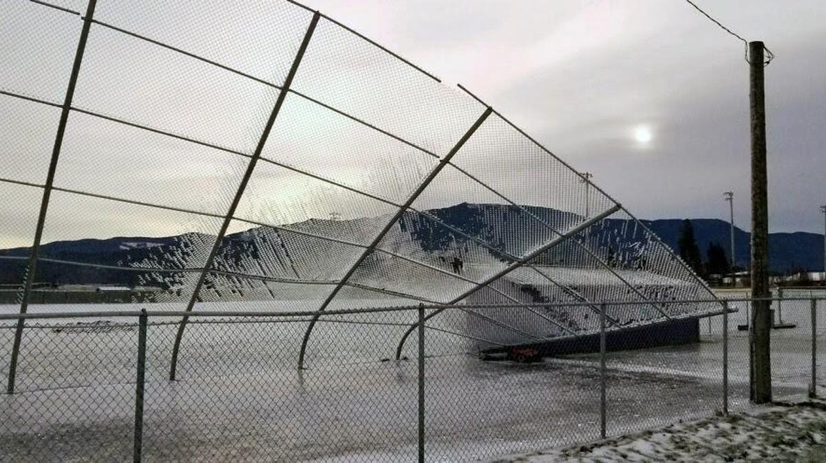 A fence near the varsity baseball field at Nooksack Valley High School is damaged Tuesday after a weekend ice storm hit the area.