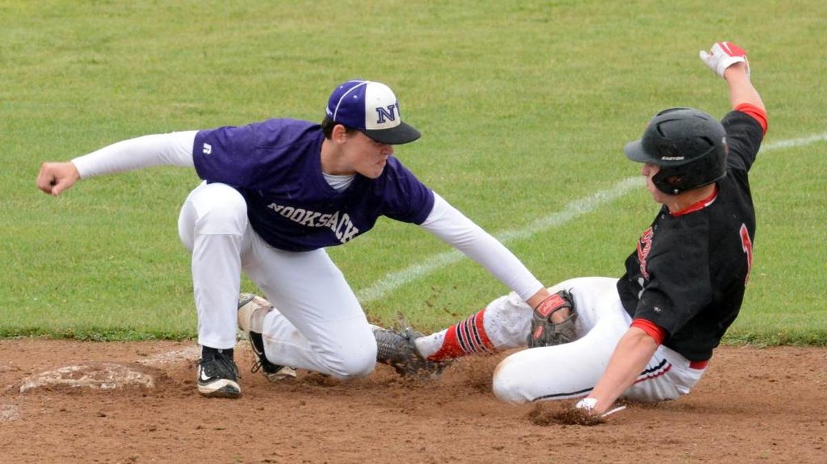 Nooksack Valley third baseman Kyle Veldman tags out a Tenino runner during a Class 1A State Tournament regional game Saturday, May 21, at Castle Rock High School.