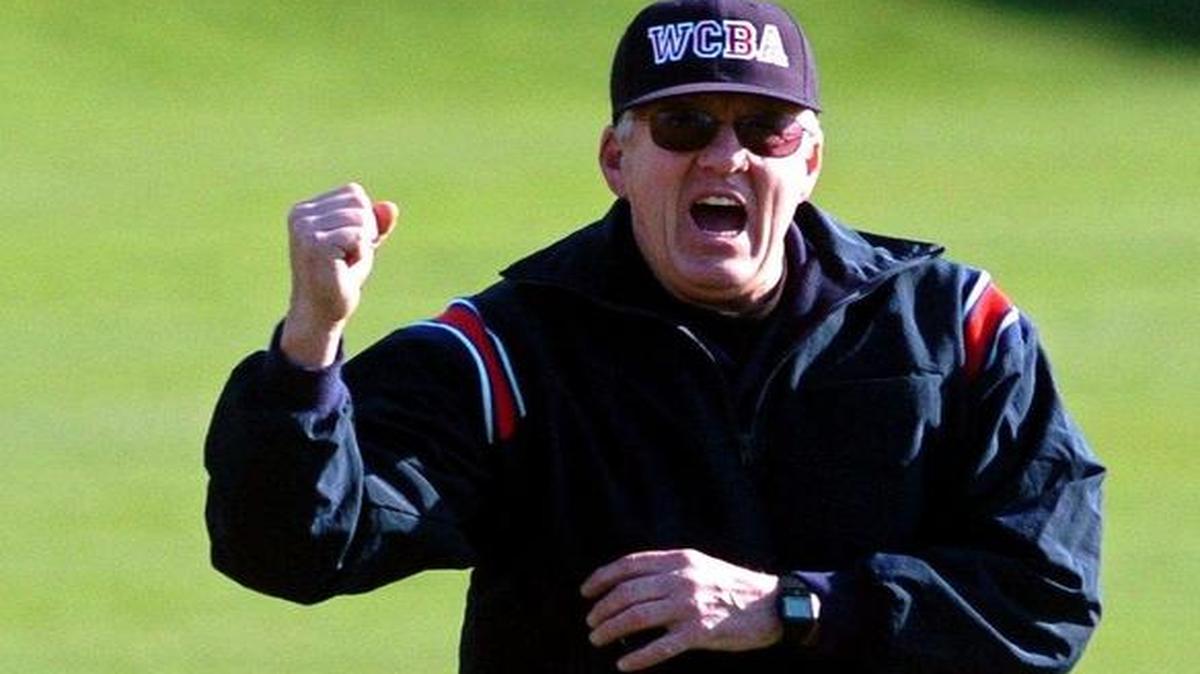 Umpire Don Murdzia calls a runner out during a 2005 baseball game. Murdzia was recently honored by the Washington State Senate.