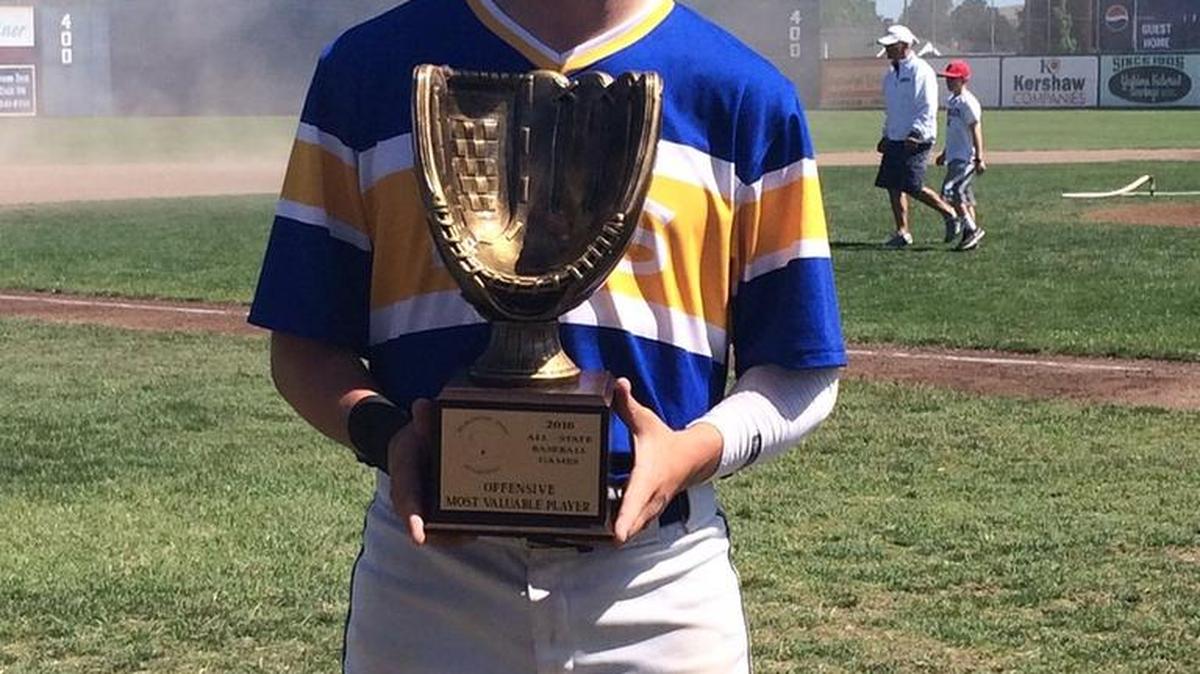 Ferndale’s Kyle Sandstrom holds his Offensive MVP trophy after going 4 for 5 with three RBI during the championship game of the Washington State All-Star Baseball Tournament on Sunday, June 12, in Yakima