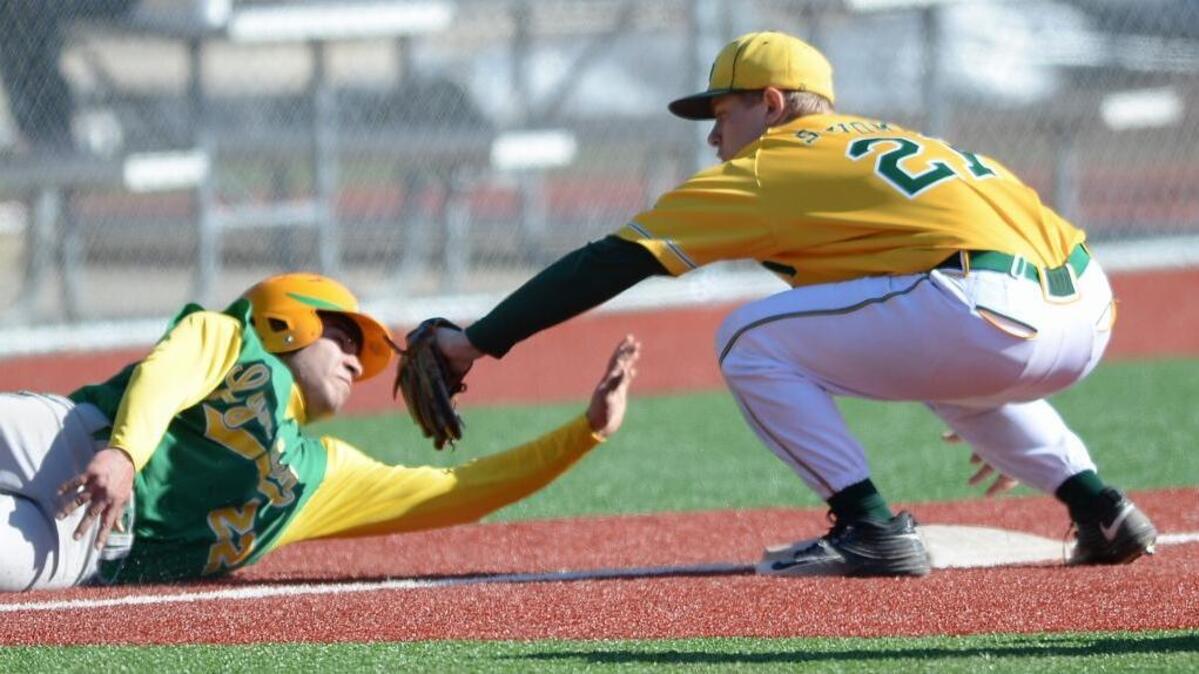 Lynden High's Marcos VanderVeen is tagged out at third base by Sehome High's Shane Jamison during their baseball game at Joe Martin Field in Bellingham Monday, April 3.