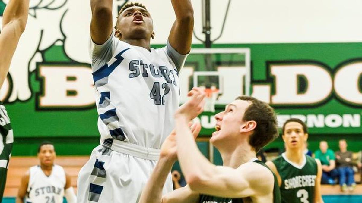 Squalicum’s Josiah Westbrook (42) shoots over Shorecrest’s Tobyn Lawson (21) in the Class 2A District Tournament championship game Saturday, Feb. 20, at Mount Vernon High School.