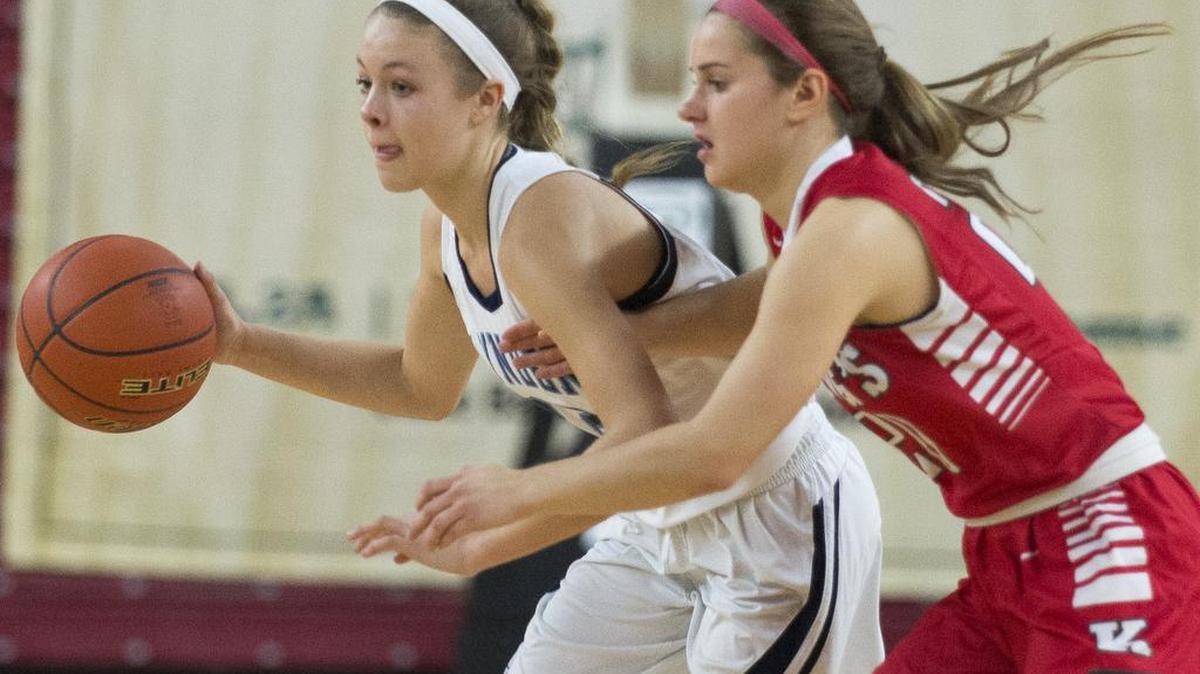 Lynden Christian’s Avery Dykstra drives toward the basket during the 1A girls’ state championship game against King’s Saturday, March 5, at the Yakima Valley SunDome.