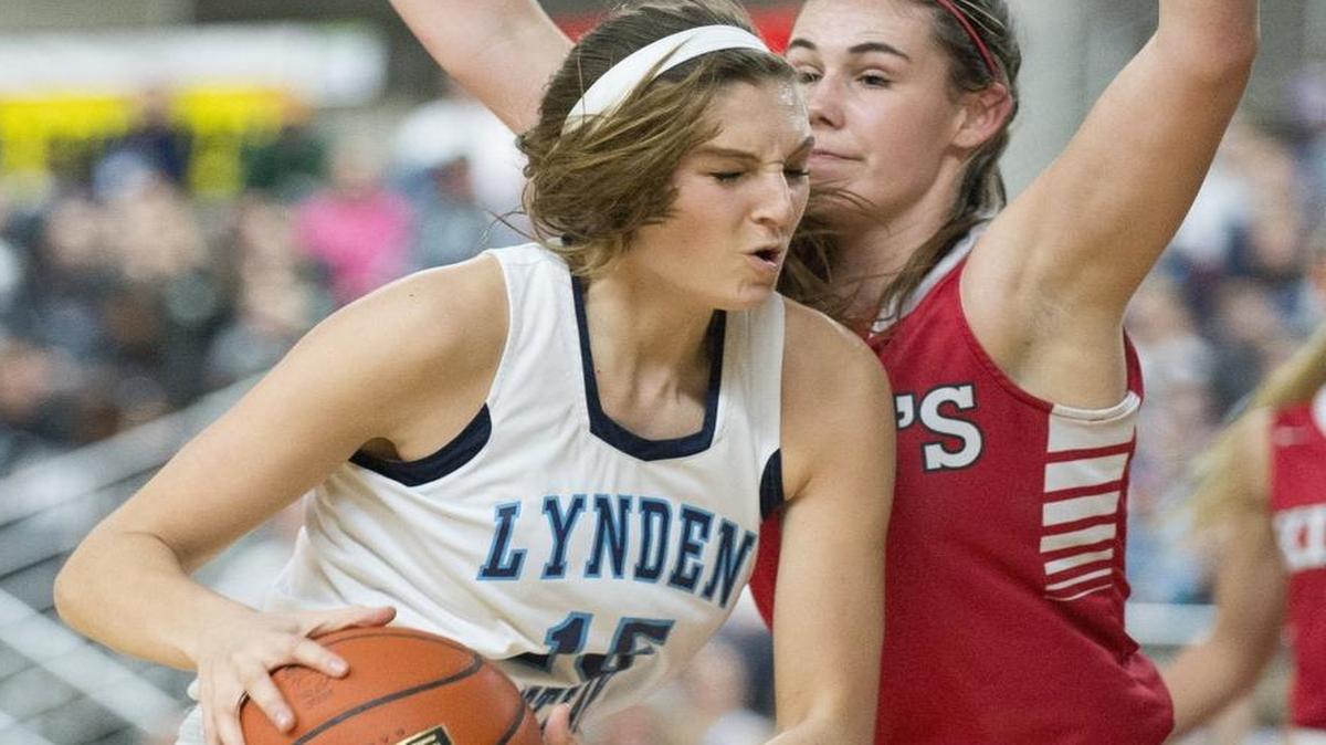 Lynden Christian’s Kara Bajema drives toward the basket during the 1A girls' state championship game against King’s March 5 at the Yakima Valley SunDome.