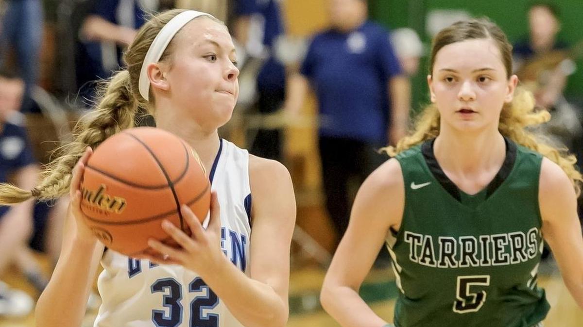 Lynden Christian’s Avery Dykstra (32) passes to an open teammate in a 2016 game against Charles Wright. She has signed to play basketball for Western Washington.
