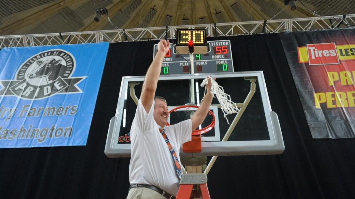 Lynden Christian coach Cur De Haan celebrates after the Lyncs beat in the 2014 Class 1A State Championshipg Game at the Yakima Valley SunDome.