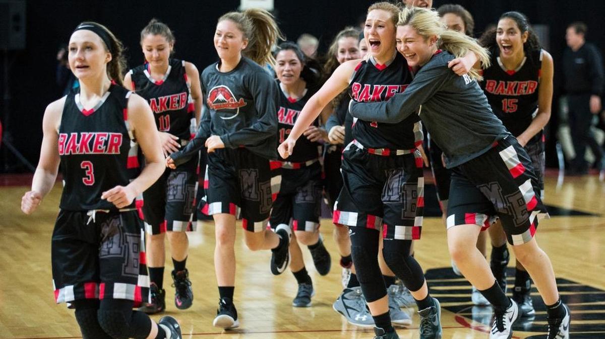 Mount Baker players celebrate a 65-58 overtime victory over Granger on Friday, March 3, at the Yakima Valley SunDome in Yakima. The Mountaineers advance to the Class 1A state championship game against top-ranked Cashmere.