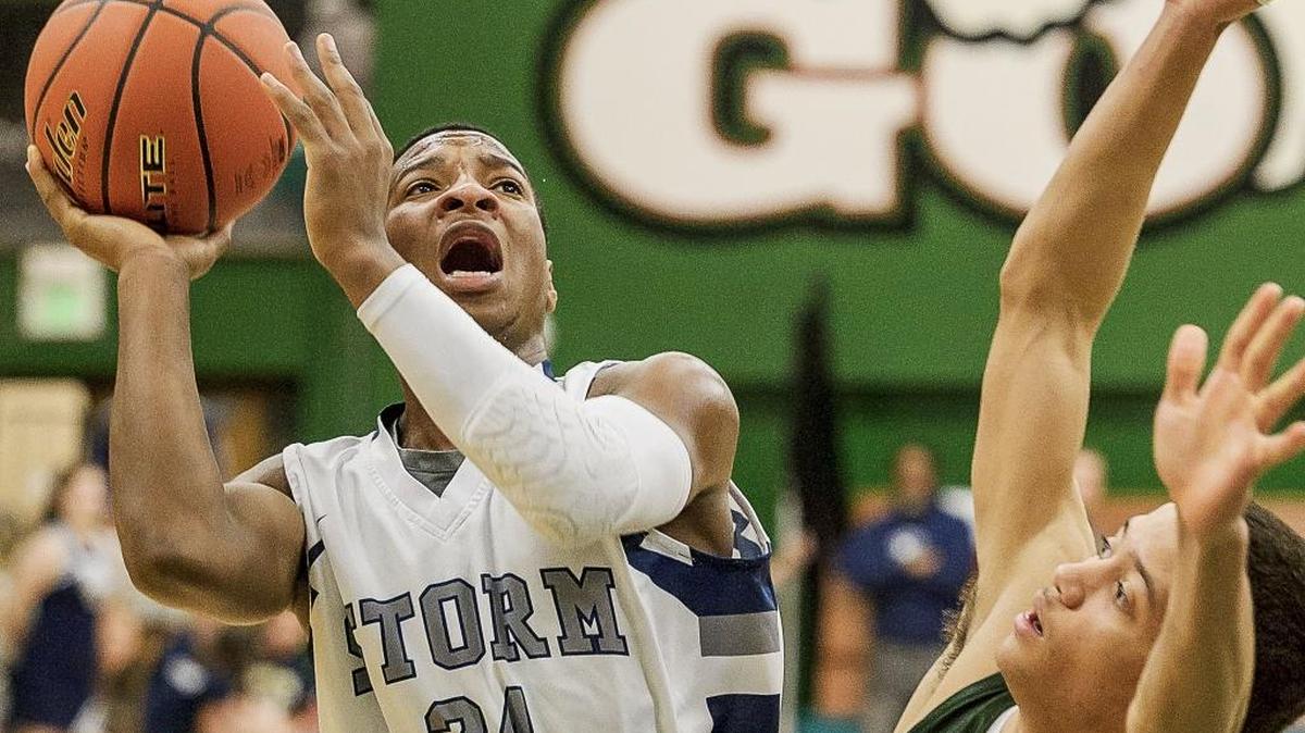 Squalicum’s Damek Mitchell (24) goes up against Shorecrest’s Malcolm Rosier-Butler during the first quarter in the Class 2A District 1 Boys Tournament final on Saturday Feb. 20, at Mount Vernon High School.