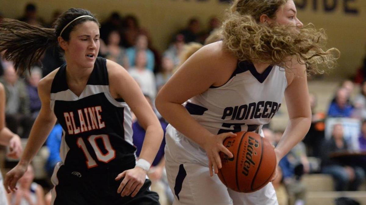 Nooksack Valley’s Emilia Gimmaka, right, grabs a rebound against Blaine on Friday, Jan. 3, 2014.