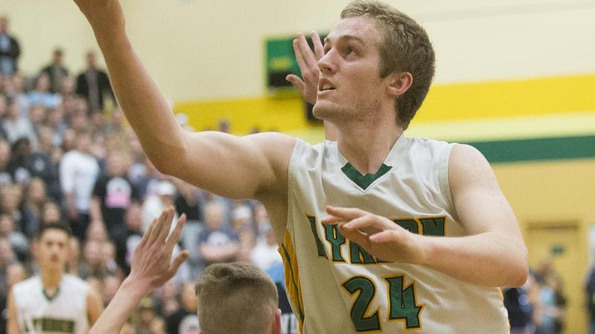 Lynden’s Andrew Kivlighn shoots and scores while being fouled in the fourth quarter of a 43-40 victory over Lynden Christian on Thursday, Jan. 19, at Lynden High School in Lynden.