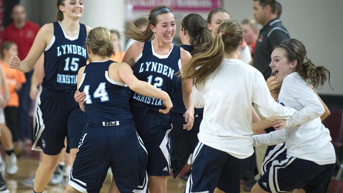 Lynden Christian celebrates beating Cashmere 51-40 in a 1A girls’ state quarterfinal Thursday, March 3, at the Yakima Valley SunDome.