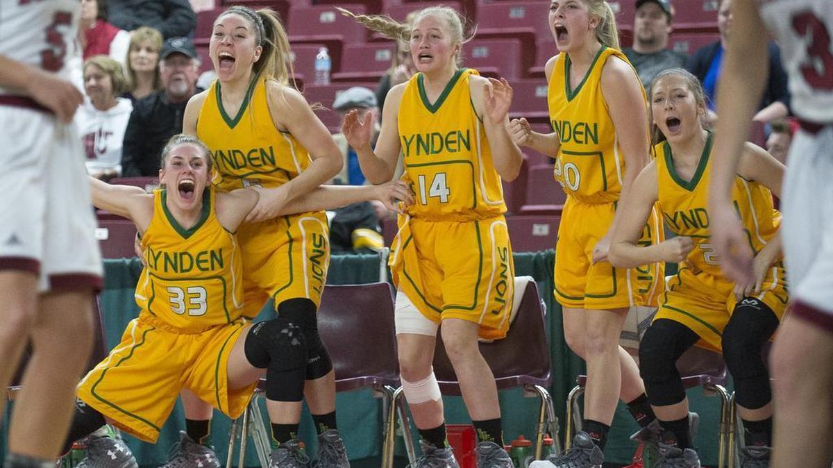 Lynden players, from left to right, Natalie Amos, Jasmyne Neria, Keylie Hershey, Heidi Lankhaar and Liv Tjoelker celebrate a basket by Mariah Gonzalez in the final minute of a 61-53 victory over W.F. West in a 2A state semifinal game on Friday, March 3, at the Yakima Valley SunDome in Yakima. Lynden advances to the state championship game with the win. 