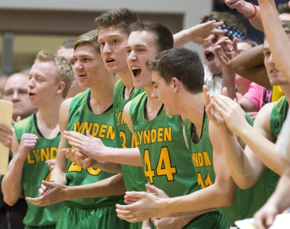 Lynden’s bench cheers during a 71-68 win over Lynden Christian on Thursday, Jan. 21, at Lynden Christian High School in Lynden.