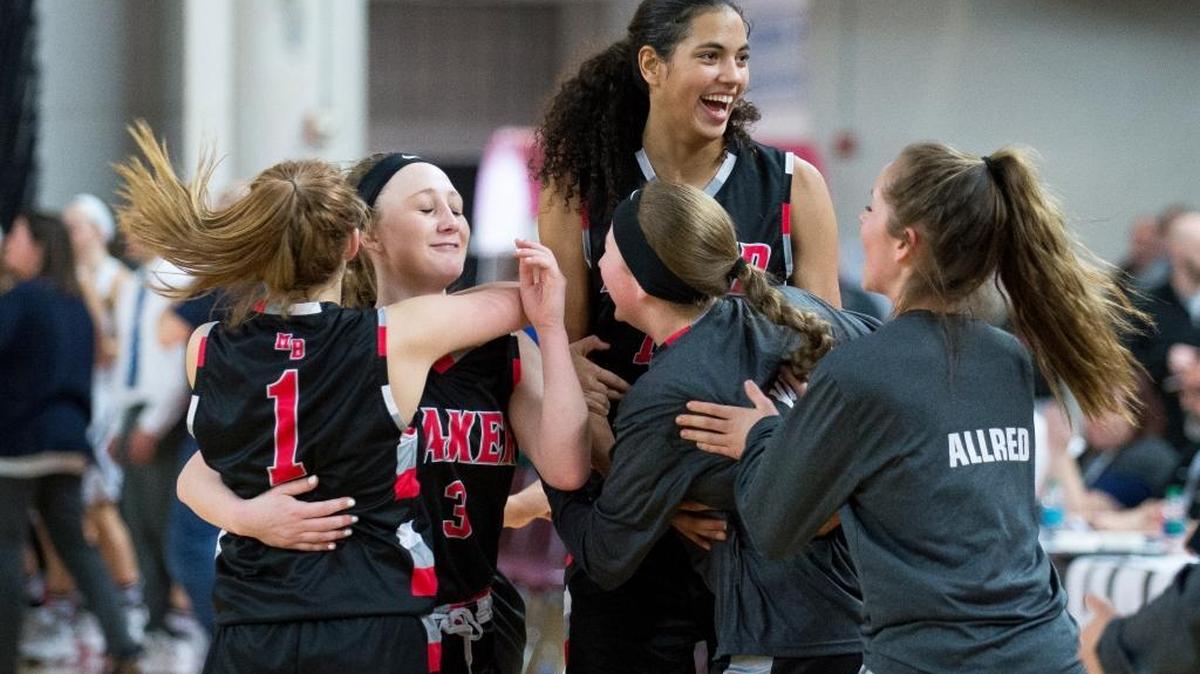 Mount Baker players, from left to right, Haylee Malone, Danielle Tyler, Stephanie Soares, Abby Yost and Portia Allred celebrate on the court after defeating Lynden Christian, 57-49, at the Class 1A Hardwood Classic on Thursday, March 2, at the Yakima Valley SunDome in Yakima.