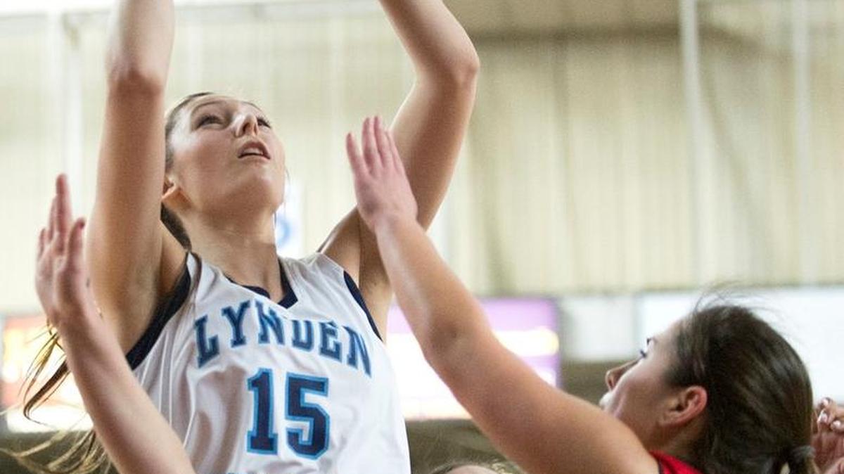 Lynden Christian's Kara Bajema goes for a layup over Granger defenders in a Class 1A State Tournament consolation game on Saturday, March 7, at the Yakima Valley SunDome in Yakima, Washington. Lynden Christian took fourth place with the win.