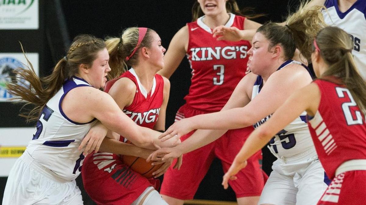 Nooksack Valley’s Rachel Sande, left, and Emilia Gimmaka fight for a rebound during a loss to King’s in a girls’ 1A state semifinal Friday, March 4, at the Yakima Valley SunDome.