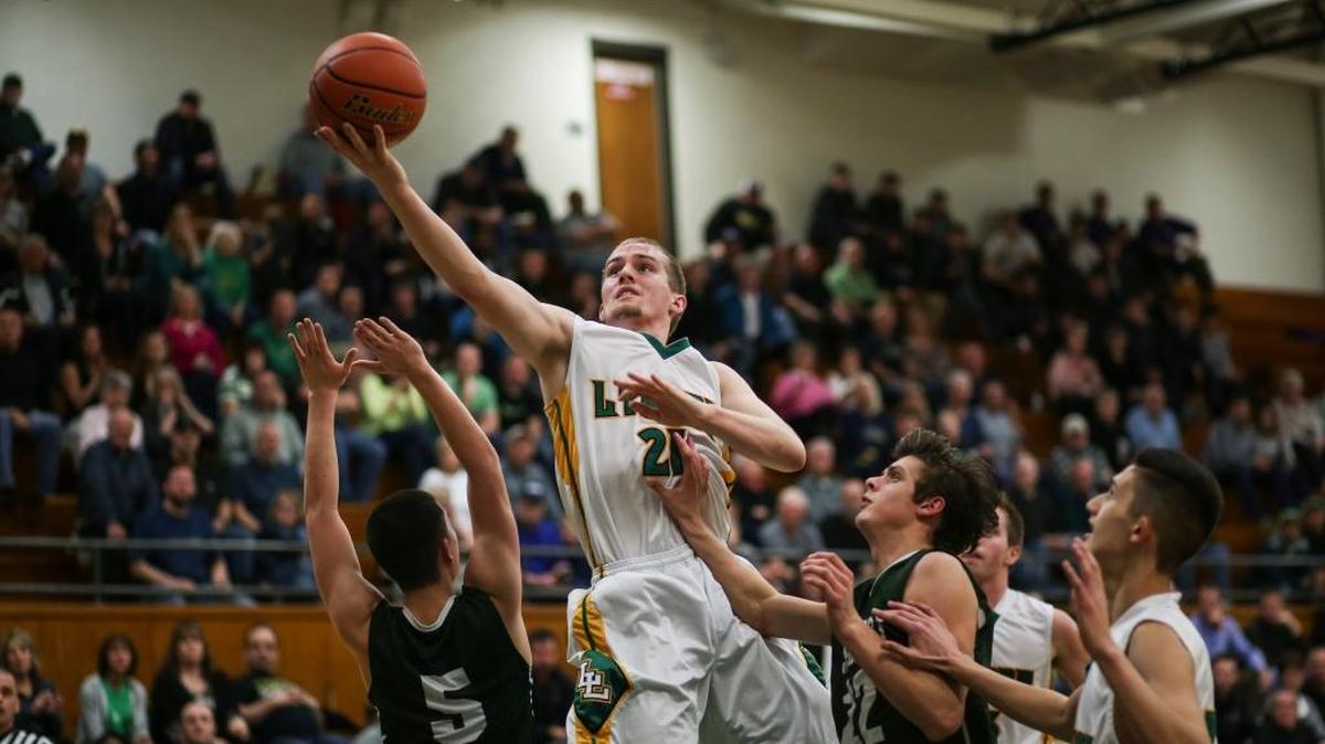 Lynden’s Andrew Kivlighn makes a lay-up to tie Shorecrest 40-40 in the third quarter of a Class 2A Northwest District tournament game against Shorecrest on Tuesday, Feb. 16, at Mount Vernon High School. Shorecrest defeated Lynden 63-44.