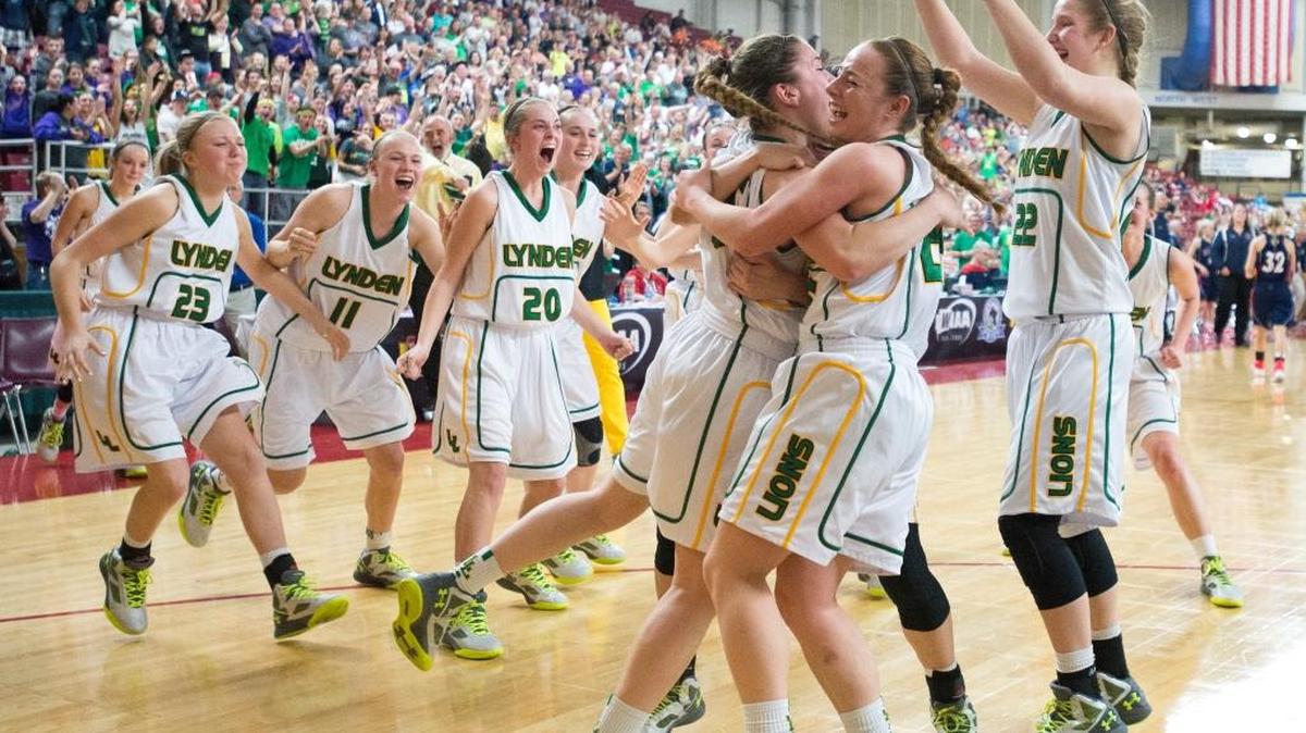 Lynden players celebrate defeating Ellensberg 37-34 in the 2A girls' semifinal game to advance to the state championship on Friday, March 4, at the Yakima Valley SunDome.