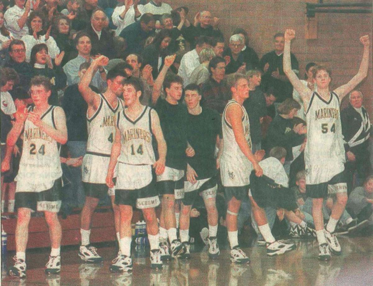 Sehome players, from left, Jeff Chapman, Keith Koskela, Jared Stevenson, Matt Stuff, Josh Turrell, Ryan Kettman and Mark Spink celebrate a win over Mount Vernon Jan. 16, 1996
