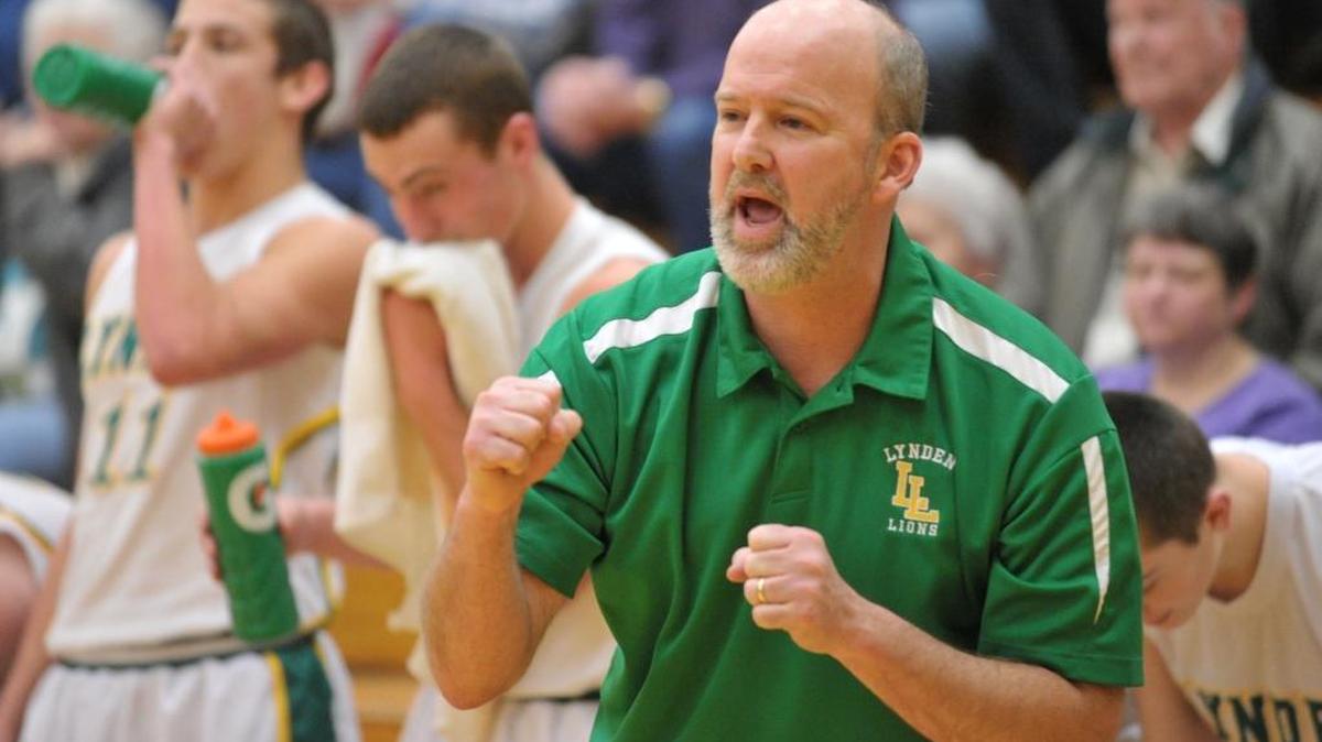 Lynden boys' head coach Brian Roper pumps a fist as the Lions score three points as Lynden Christian took on Lynden in a Northwest Conference boys' basketball game on Tuesday Jan. 10, 2012, in Lynden.