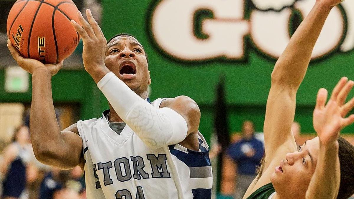 Squalicum's Damek Mitchell (24) goes up against Shorecrest’s Malcolm Rosier-Butler during the first quarter in the 2A District 1 Boys Tournament Final on Saturday evening Feb. 20, 2016, at Mount Vernon High School.