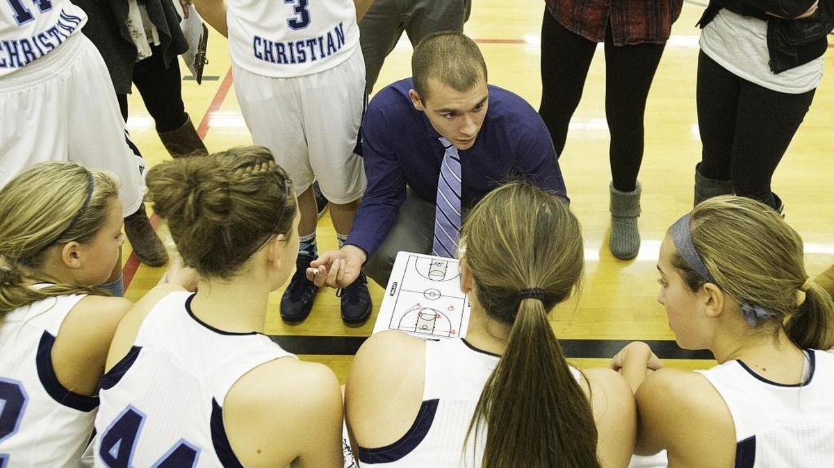 Lynden Christian basketball coach Brady Bomber gives his team in instructions during a game in December 2014.