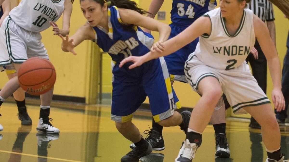 Ferndale’s Darrien Camarillo and Lynden’s Mandy Warner chase after a loose ball Jan. 30, at Lynden High School.