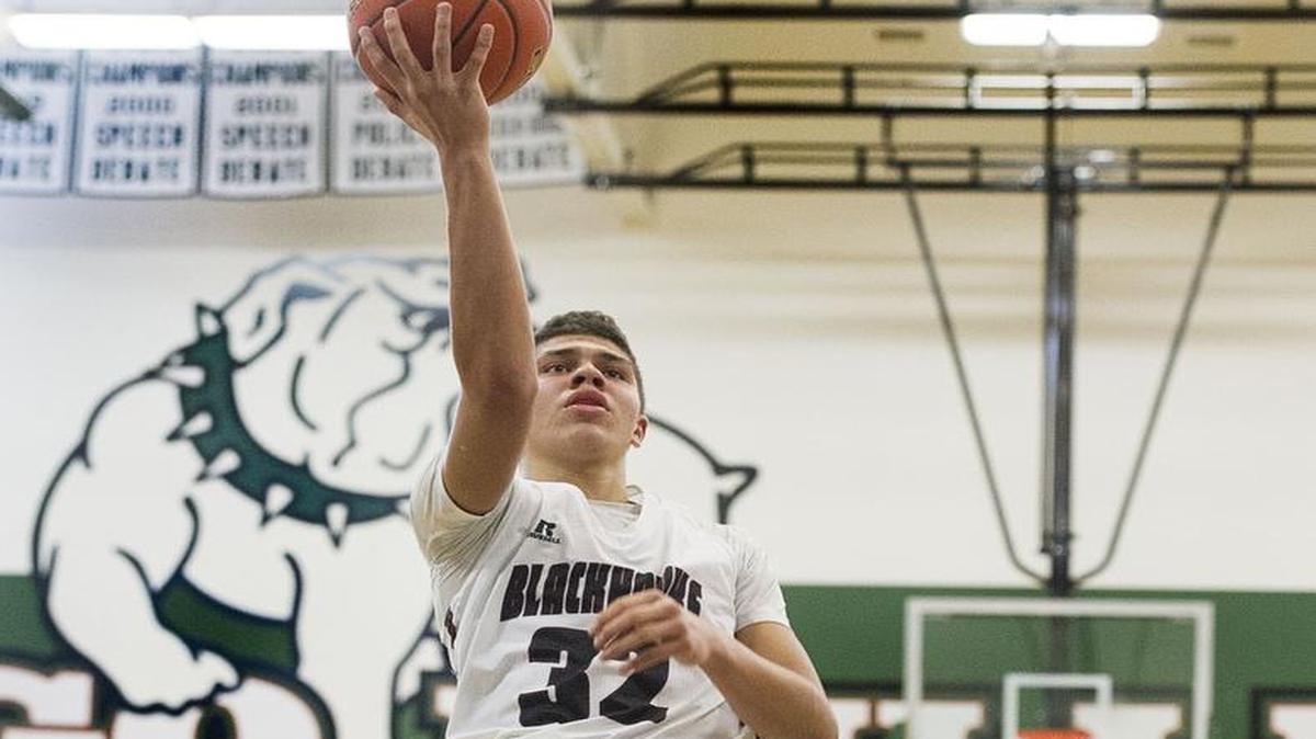 Lummi’s Trazil Lane (32) lays one up for two points against Mt. Rainer Lutheran during the regional round of the 2015 Class 1B State Tournament at Mount Vernon High School. Lane was selected the 2017 Class 17 All-State Player of the Year.
