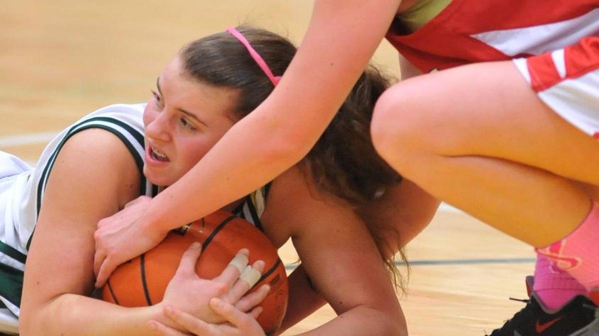 Sehome’s Madison MacPhee, left, and Bellingham’s Michaela Knutson battle for a loose ball on the floor Jan. 24, 2014.