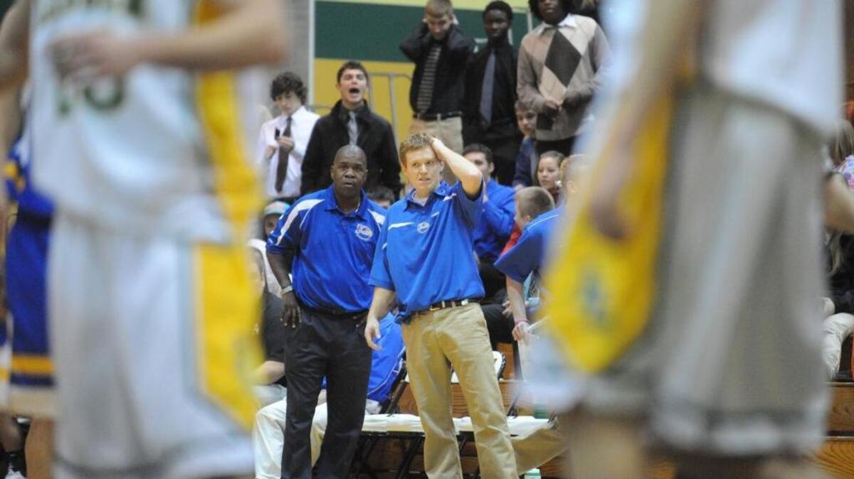 Former Ferndale coach Scott Larrabee, right, looks to the court late in a game against Lynden in January 2009. Larrabee was hired as Sehome’s new girls basketball coach.